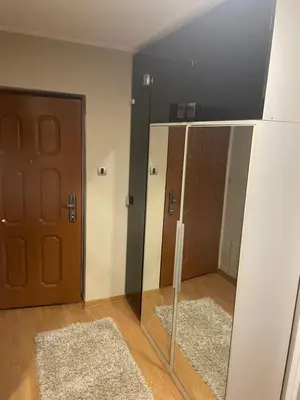 a room with two doors and a mirror at Panorama Bulevar in Niš