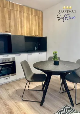 a dining room with a table and chairs at Sofema in Pirot
