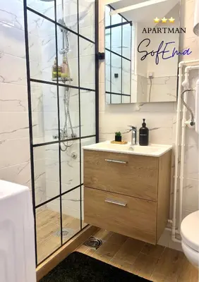 a bathroom with a sink and a mirror at Sofema in Pirot
