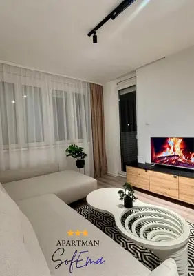a living room with a couch and a tv at Sofema in Pirot
