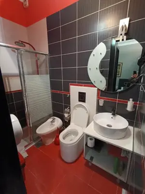 a bathroom with a toilet and a sink and a mirror at Топ соба 2 in Niš