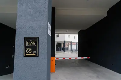 an empty room with a sign on a wall at NAR Royalton Suite #65 Free Parking in Niš