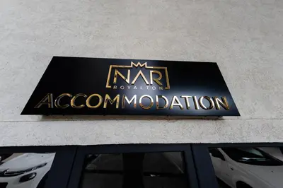 a sign for an acm association on the side of a building at NAR Royalton Suite #65 Free Parking in Niš