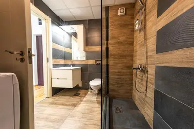 a bathroom with a toilet and a sink at NAR Royalton Suite #65 Free Parking in Niš
