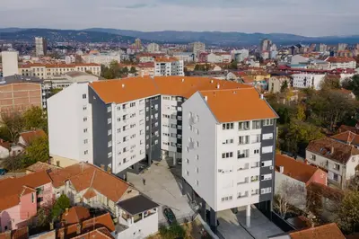 an overhead view of a white building with an orange roof at NAR Royalton Suite #65 Free Parking in Niš