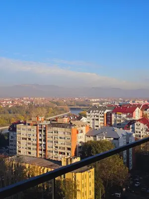a view of a city with buildings and a river at Riviera Suite in Niš