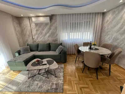 a living room with a couch and a table at Apartman LaCasa Mia in Vrnjačka Banja