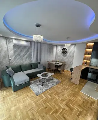 a living room with a couch and a table at Apartman LaCasa Mia in Vrnjačka Banja