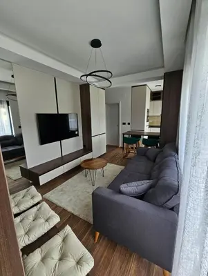 a living room with a couch and a tv at Apartman Vrabac in Vrnjačka Banja