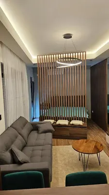 a living room with a couch and a table at Apartman Vrabac in Vrnjačka Banja