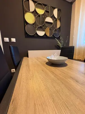 a wooden table with a bowl on top of it at NAR Royalton Deluxe Apartment #74 Free Parking in Niš