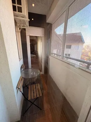 a room with a glass table and a window at NAR Royalton Deluxe Apartment #74 Free Parking in Niš