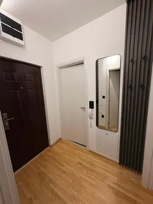 an empty room with a door and a mirror at NAR Royalton Apartment #25 Free Parking in Niš
