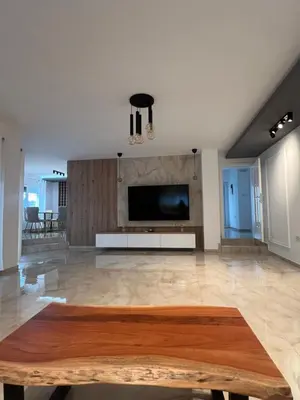 a living room with a television and a table at Party&Stay by N