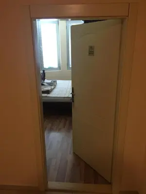 a door leading into a room with a window at Bed & Breakfast Karavan in Raška