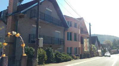 a building on the side of a street at Bed & Breakfast Karavan in Raška
