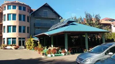 a car parked in front of a building at Bed & Breakfast Karavan in Raška