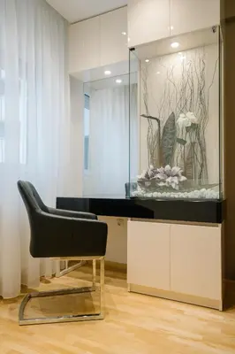 a black chair in a room with a glass case at NAR Royalton Deluxe Apartment #40 Free Parking in Niš