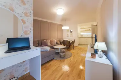 a living room with a laptop on a counter at NAR Royalton Apartment #71 Free Parking in Niš