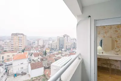 a balcony with a view of a city at NAR Royalton Apartment #71 Free Parking in Niš