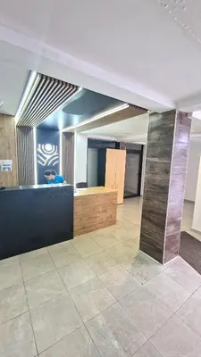 a room with a counter and a tile floor at Sunny Hill Kop - Luxury Apartment Mountain View in Kopaonik