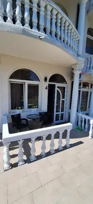 a white bench in front of a house at Soko Bajka 2 in Soko Banja