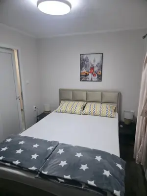 a bedroom with a large bed with stars on it at Black House Spa