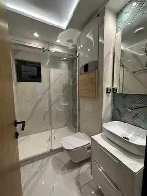 a bathroom with a shower and a toilet and a sink at Vila Golija Sky View Kopaonik in Kopaonik