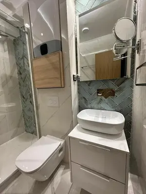a small bathroom with a toilet and a sink at Vila Golija Sky View Kopaonik in Kopaonik