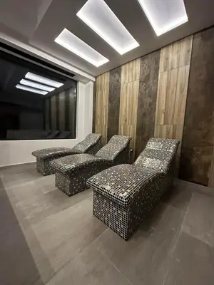 a waiting room with four chairs and a table at Vila Golija Sky View Kopaonik in Kopaonik