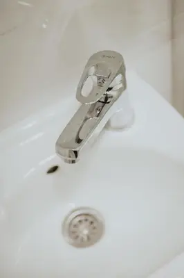 a sink with a faucet in a bathroom at Gallus Inn in Aleksinac