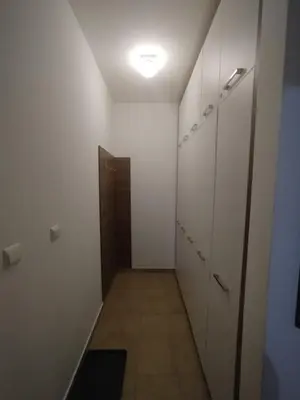 a hallway with a row of lockers in a room at Apartman Foka Spa in Brzeće