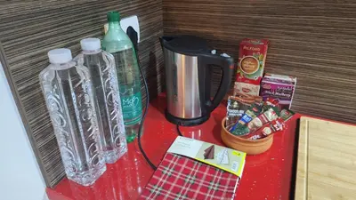 a table with two plastic bottles on top of it at Play Apartments in Paraćin