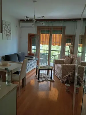 a living room with a couch and a table at apartman Nevena in Vrnjačka Banja