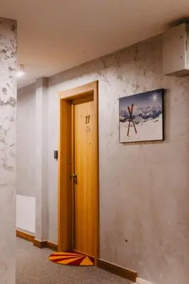 a room with a door and a picture on the wall at Sonja apartman Vila Bela reka Brzeće Kopaonik in Brzeće