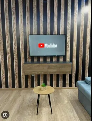 a living room with a tv and a coffee table at Apartman Brankovic in Jagodina