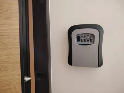 a remote control on the wall of a door at Harmony Dream in Jagodina