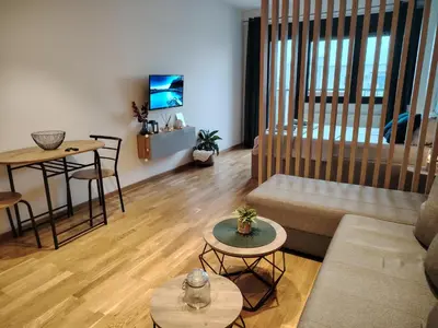 a living room with a couch and a table at Harmony Dream in Jagodina