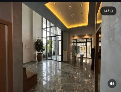 a lobby with a potted plant in a building at Harmony Dream in Jagodina