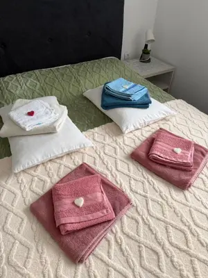 a group of towels on top of a bed at Apartman Petra Sokobanja in Soko Banja