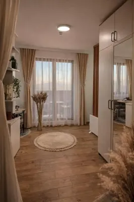 a large living room with a large window at Planinski san in Kopaonik