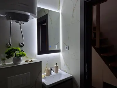 a bathroom with a sink and a mirror at Vikvid in Kopaonik