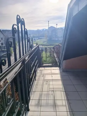 a view from the balcony of a building with a gate at Apartman Paunov Breg in Vrnjačka Banja