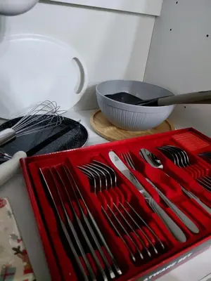 a red tray of utensils sitting on a kitchen counter at Warm nest in Kraljevo
