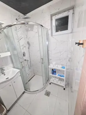 a bathroom with a shower and a sink at Warm nest in Kraljevo