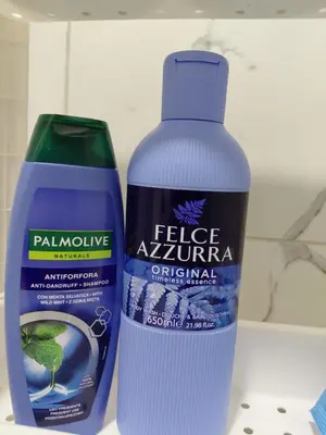 a bottle of water and a container of fertilizers at Warm nest in Kraljevo