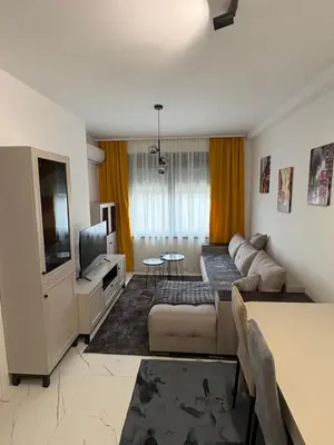 a living room with a couch and a tv at Nik 1 in Kruševac