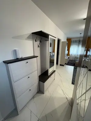 a room with a dresser and a mirror at Nik 1 in Kruševac