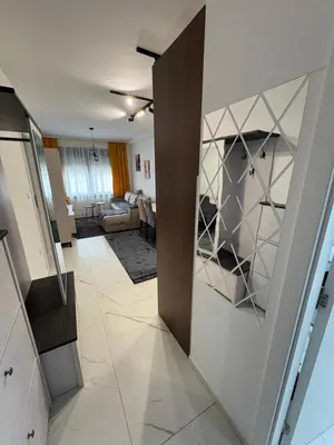 a room with a hallway with a living room at Nik 1 in Kruševac