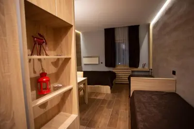 a small room with a bed and a small bedroom at Apartment HT in Kopaonik